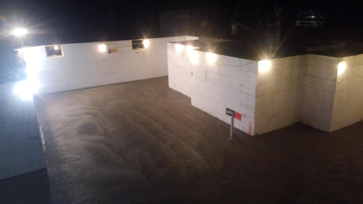 Foundation wall with electrical lighting installed at night