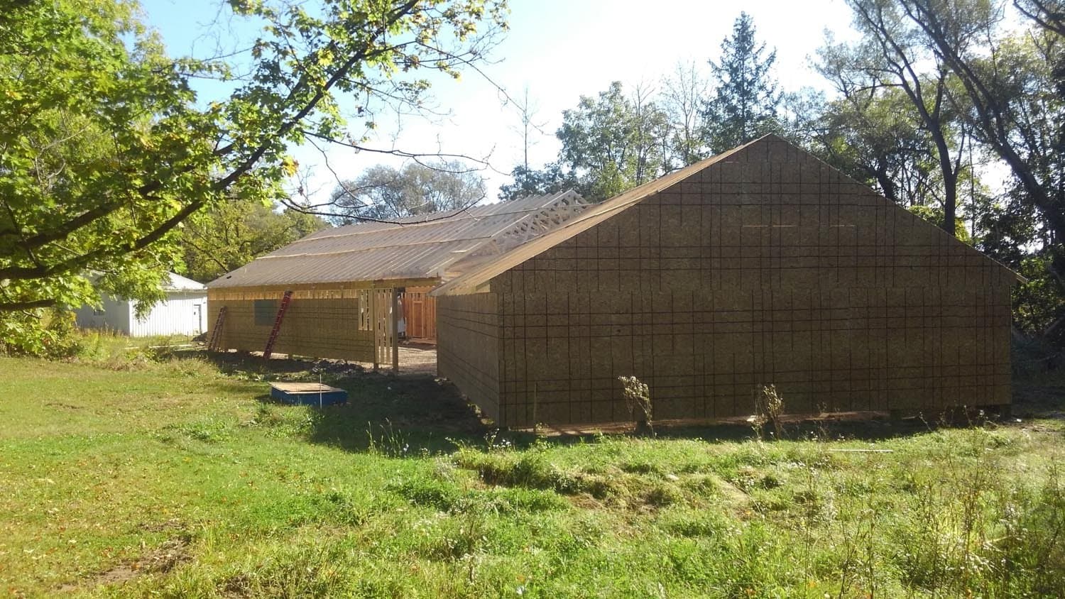 Pole barn construction in progress showing wood framing and roof structure